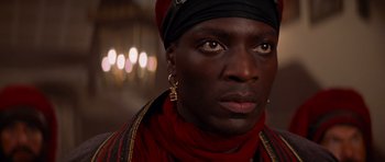 Movie still from “The Mummy Returns” (2001), directed by Stephen Sommers – A person wearing a headscarf; Close Up shot, High angle