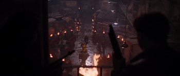 Movie still from “The Mummy Returns” (2001), directed by Stephen Sommers – A group of people standing in a room with candles; Extreme Wide shot, High angle