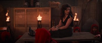 Movie still from “The Mummy Returns” (2001), directed by Stephen Sommers – A woman sitting on the ground in front of a fireplace; Wide shot, High angle