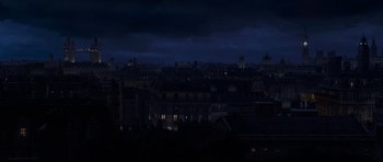 Movie still from “The Mummy Returns” (2001), directed by Stephen Sommers – A dark city skyline at night with a lot of lights on it; Extreme Wide shot, High angle