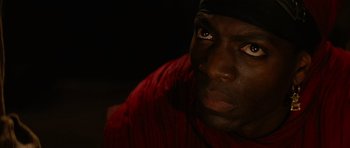 Movie still from “The Mummy Returns” (2001), directed by Stephen Sommers – A man's face in the dark; Close Up shot, High angle