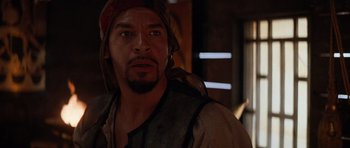 Movie still from “The Mummy Returns” (2001), directed by Stephen Sommers – A person wearing a hat and looking at the camera; Close Up shot, Over the shoulder angle