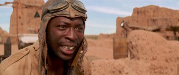 Movie still from “The Mummy Returns” (2001), directed by Stephen Sommers – An african american man wearing a hat and goggles; Close Up shot, Low angle