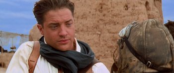Movie still from “The Mummy Returns” (2001), directed by Stephen Sommers – A person wearing a scarf; Close Up shot, Over the shoulder angle