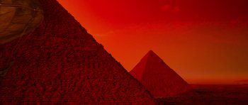 Movie still from “The Mummy Returns” (2001), directed by Stephen Sommers – A red sky with a pyramid in the background; Extreme Wide shot, Low angle
