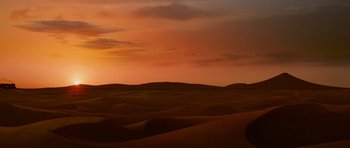 Movie still from “The Mummy Returns” (2001), directed by Stephen Sommers – A desert landscape with a sunset in the background; Extreme Wide shot, Low angle