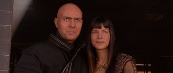 Movie still from “The Mummy Returns” (2001), directed by Stephen Sommers – A man and a woman posing for a picture; Close Up shot, Low angle