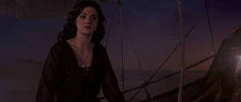 Movie still from “The Mummy Returns” (2001), directed by Stephen Sommers – A woman standing on top of a boat at night; Medium shot, High angle