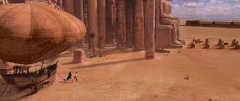 Movie still from “The Mummy Returns” (2001), directed by Stephen Sommers – A group of people walking through a desert area; Extreme Wide shot, Low angle