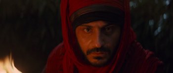 Movie still from “The Mummy Returns” (2001), directed by Stephen Sommers – A person wearing a head covering; Close Up shot, Low angle