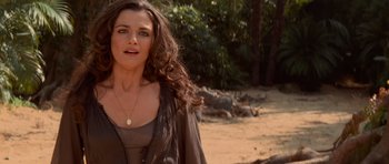 Movie still from “The Mummy Returns” (2001), directed by Stephen Sommers – A beautiful woman standing on top of a sandy beach; Close Up shot, Over the shoulder angle