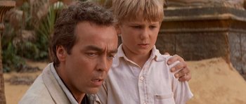 Movie still from “The Mummy Returns” (2001), directed by Stephen Sommers – A man and a young boy looking at each other; Close Up shot, Over the shoulder angle