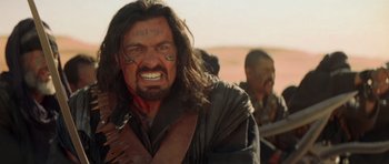 Movie still from “The Mummy Returns” (2001), directed by Stephen Sommers – A person with long hair; Close Up shot, Over the shoulder angle