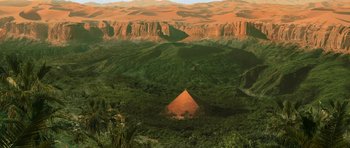 Movie still from “The Mummy Returns” (2001), directed by Stephen Sommers – An aerial view of a pyramid in the middle of the desert; Extreme Wide shot, High angle