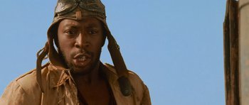 Movie still from “The Mummy Returns” (2001), directed by Stephen Sommers – A person wearing a hat; Close Up shot, Low angle