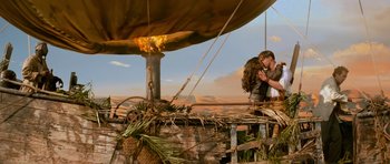 Movie still from “The Mummy Returns” (2001), directed by Stephen Sommers – A couple kissing on a boat in the middle of the desert; Wide shot, Low angle