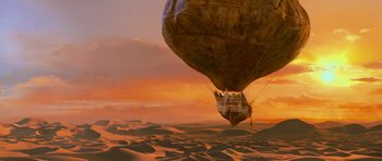 Movie still from “The Mummy Returns” (2001), directed by Stephen Sommers – An air balloon floating in the middle of the desert; Extreme Wide shot, Low angle