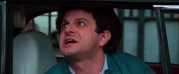 Movie still from “The New York Ripper” (1982), directed by Lucio Fulci – A person looking up at something; Close Up shot, Low angle