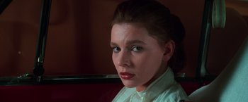 Movie still from “The New York Ripper” (1982), directed by Lucio Fulci – A person wearing a white shirt; Close Up shot, Low angle