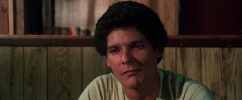 Movie still from “The New York Ripper” (1982), directed by Lucio Fulci – A person wearing a white shirt; Close Up shot, Low angle