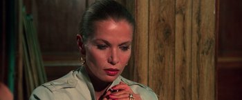 Movie still from “The New York Ripper” (1982), directed by Lucio Fulci – A person wearing a dress shirt; Close Up shot, High angle