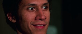 Movie still from “The New York Ripper” (1982), directed by Lucio Fulci – A man's eyes and mouth; Extreme Close Up shot, Low angle