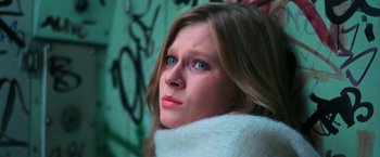 Movie still from “The New York Ripper” (1982), directed by Lucio Fulci – A person with blue eyes; Close Up shot, Low angle