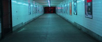 Movie still from “The New York Ripper” (1982), directed by Lucio Fulci – A long hallway with a lot of lights in it; Extreme Wide shot, High angle