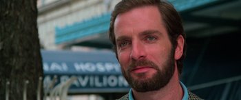 Movie still from “The New York Ripper” (1982), directed by Lucio Fulci – A person with a beard; Close Up shot, Low angle