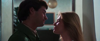 Movie still from “The New York Ripper” (1982), directed by Lucio Fulci – A man and a woman face to face in a room; Close Up shot, Low angle