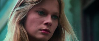 Movie still from “The New York Ripper” (1982), directed by Lucio Fulci – A woman's face with green eyes; Close Up shot, Low angle