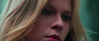 Movie still from “The New York Ripper” (1982), directed by Lucio Fulci – A woman's face with pink lipstick; Extreme Close Up shot, Low angle