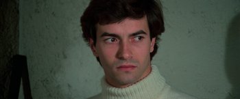 Movie still from “The New York Ripper” (1982), directed by Lucio Fulci – A person wearing a sweater; Close Up shot, High angle