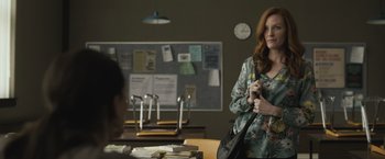 Movie still from “The Night House” (2020), directed by David Bruckner – A woman holding a purse while standing next to a man; Medium shot, Over the shoulder angle