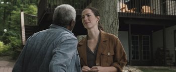 Movie still from “The Night House” (2020), directed by David Bruckner – A woman standing next to an older man outside; Medium shot, Over the shoulder angle