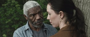 Movie still from “The Night House” (2020), directed by David Bruckner – An older man and a younger woman looking at each other; Close Up shot, Over the shoulder angle