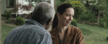Movie still from “The Night House” (2020), directed by David Bruckner – A woman and an older man are talking to each other; Close Up shot, Over the shoulder angle