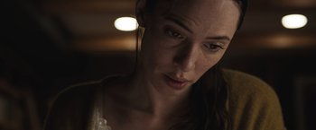 Movie still from “The Night House” (2020), directed by David Bruckner – A person wearing a white shirt; Close Up shot, Low angle