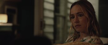 Movie still from “The Night House” (2020), directed by David Bruckner – A person sitting at a table; Close Up shot, Over the shoulder angle