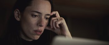 Movie still from “The Night House” (2020), directed by David Bruckner – A person holding a cell phone to their ear; Close Up shot, High angle