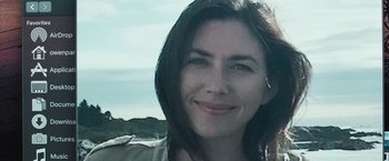 Movie still from “The Night House” (2020), directed by David Bruckner – A person smiling for a picture; Close Up shot, Low angle
