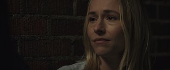 Movie still from “The Night House” (2020), directed by David Bruckner – A person looking at the camera; Close Up shot, Over the shoulder angle