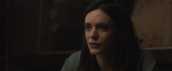 Movie still from “The Night House” (2020), directed by David Bruckner – A person sitting in a room; Close Up shot, Low angle