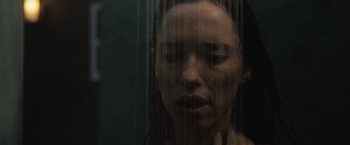 Movie still from “The Night House” (2020), directed by David Bruckner – A woman is taking a bath in the shower; Close Up shot, Low angle