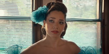 Movie still from “The Nightingale of Bursa” (2023), directed by Hakan Algül – A woman with a blue flower in her hair; Close Up shot, High angle