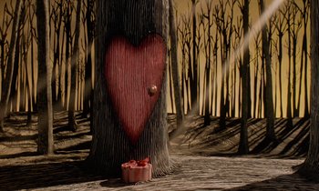 Movie still from “The Nightmare Before Christmas” (1993), directed by Henry Selick – A tree with a heart carved into it next to a box of chocolates; Extreme Wide shot, Overhead angle