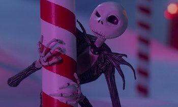 Movie still from “The Nightmare Before Christmas” (1993), directed by Henry Selick – A jack skellington figurine; Medium shot, Low angle