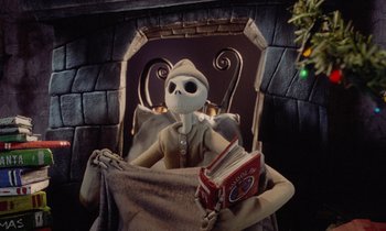 Movie still from “The Nightmare Before Christmas” (1993), directed by Henry Selick – A doll sitting in a chair holding a book; Wide shot, Low angle
