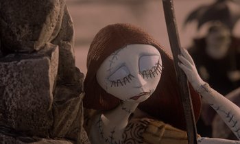 Movie still from “The Nightmare Before Christmas” (1993), directed by Henry Selick – A doll with stitched eyes; Close Up shot, Low angle