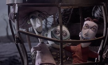 Movie still from “The Nightmare Before Christmas” (1993), directed by Henry Selick – A group of puppets are in a cage; Medium shot, Low angle